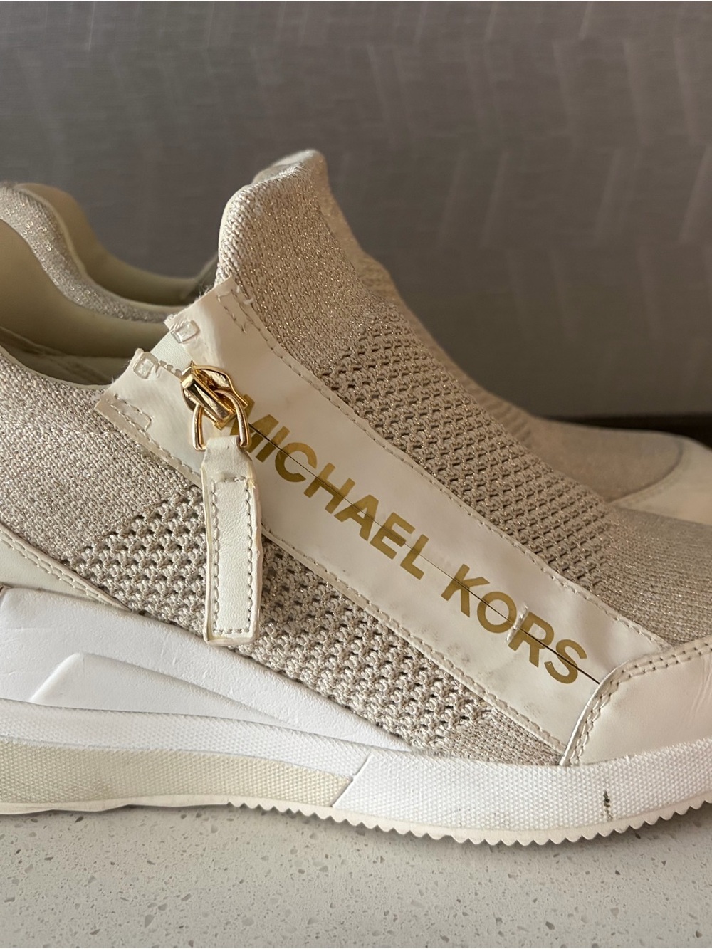 Michael Kors Cream Knit Slip-On Sneakers with Gold Logo